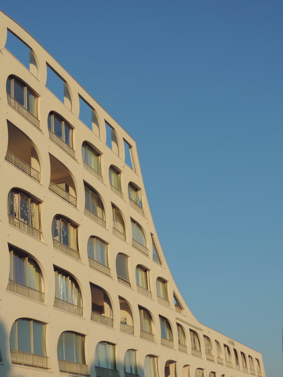 a tall building with balconies and balconies on it