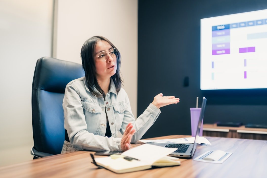 Woman gestures while explaining something at a presentation.