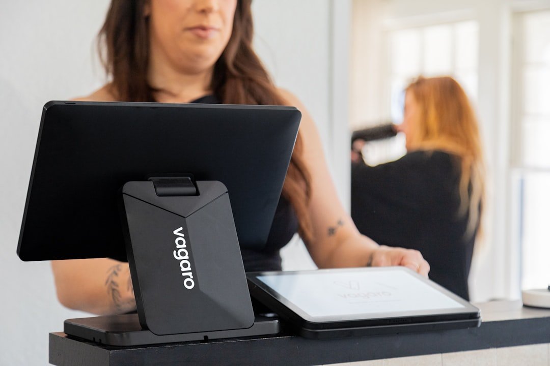 Woman using a tablet at a checkout counter