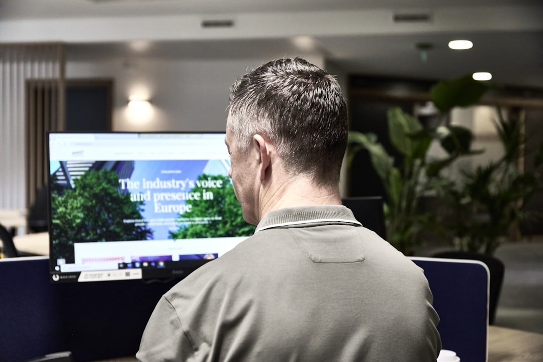 Man working on a computer in an office.
