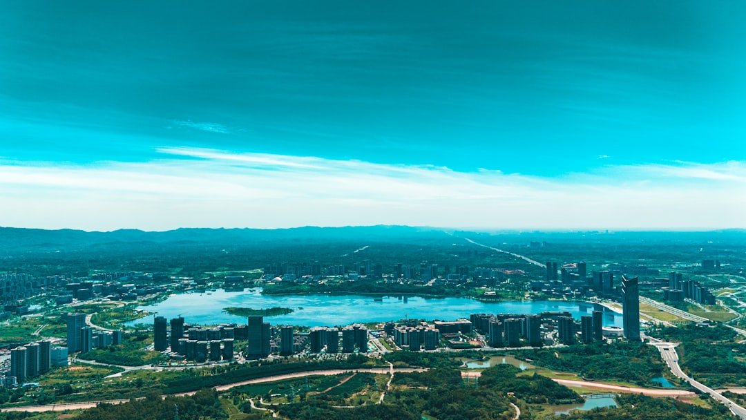 an aerial view of a city and a lake