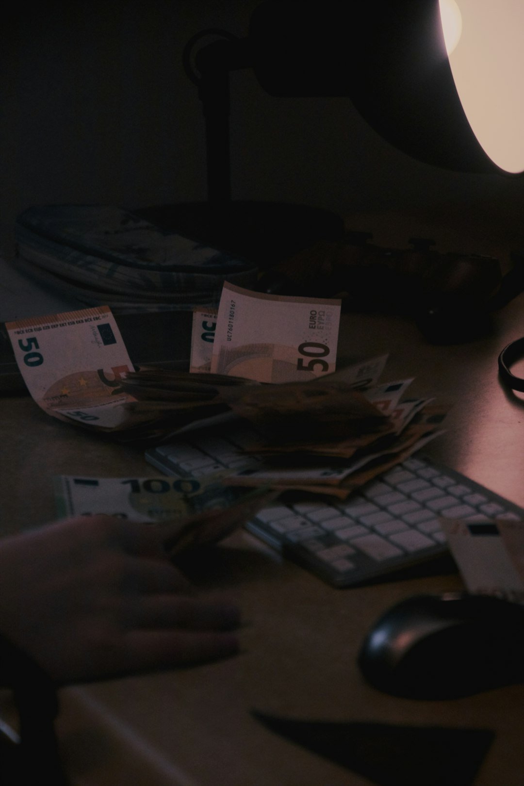 A person typing on a keyboard in front of a computer monitor