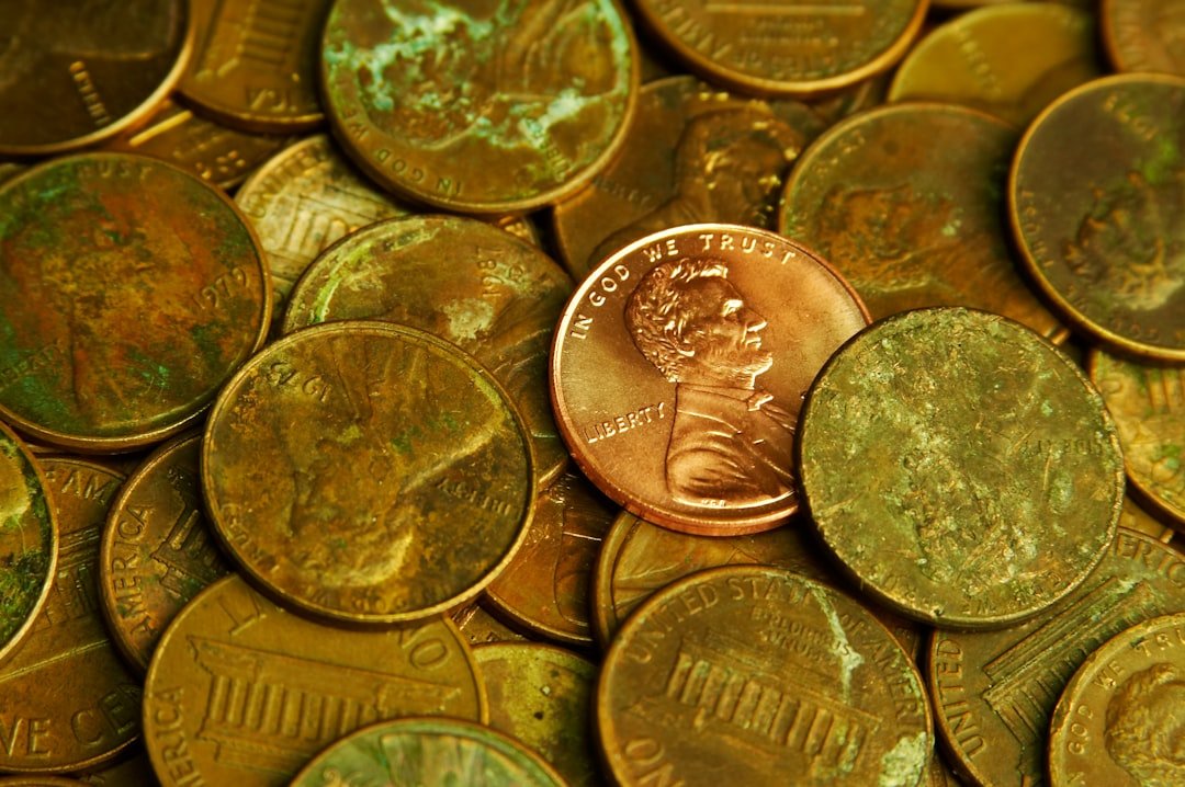 Pile of lincoln pennies with one prominent
