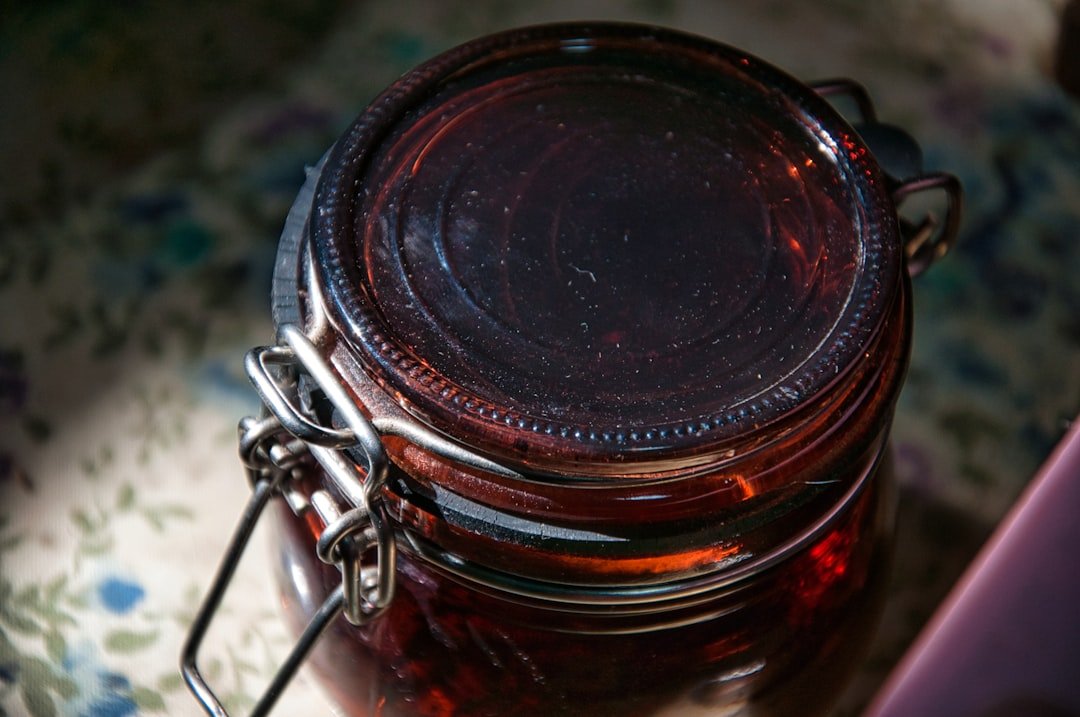 a jar of jam sitting on top of a table
